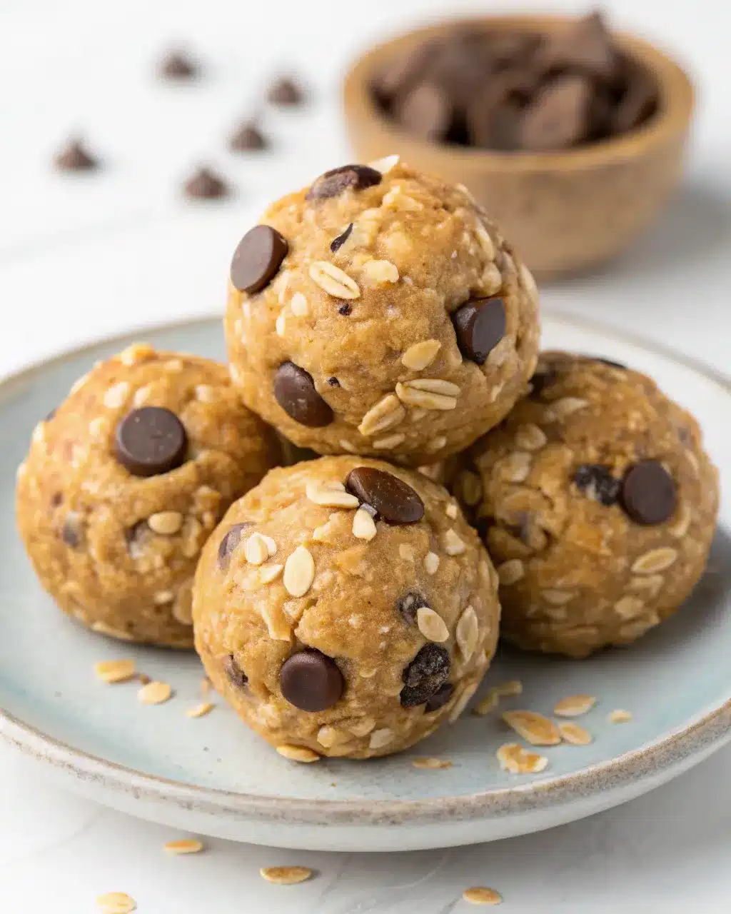 No bake chocolate chip energy balls with oats on a plate
