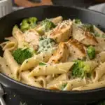 Close-up of chicken broccoli pasta with creamy sauce and Parmesan topping