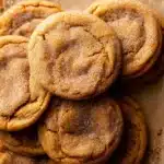 Close-up of chewy pumpkin snickerdoodle cookies with cinnamon sugar coating.