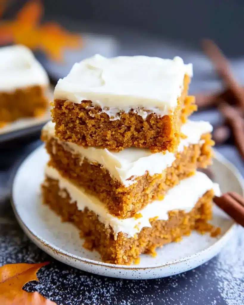 Gluten-free pumpkin bars with cream cheese frosting and powdered sugar