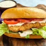 Crispy Catfish Po Boy with lettuce, tomato, and remoulade on French bread