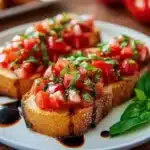Italian bruschetta with fresh tomato basil topping and balsamic drizzle