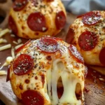 Hot pepperoni pizza bombs with stretchy melted cheese and herbs