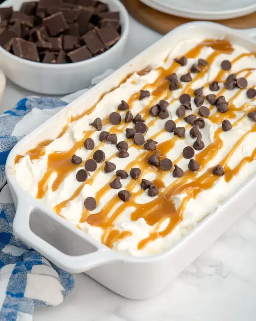 No-bake pumpkin lush topped with caramel drizzle and chocolate chips