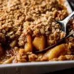 Spoonful of Pioneer Woman apple crisp with oats and cinnamon apples