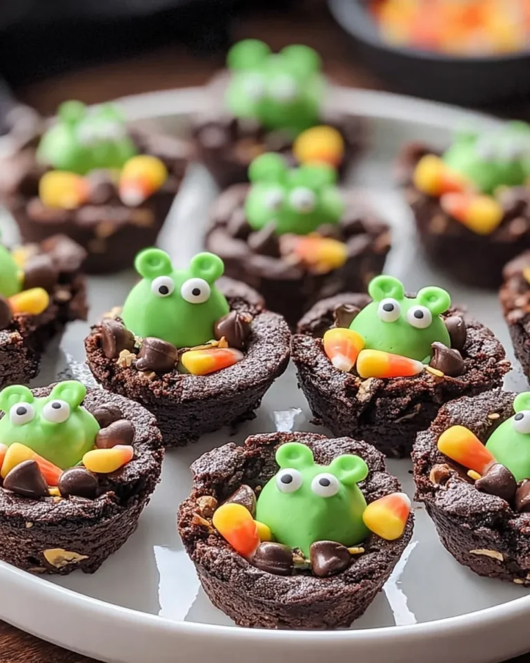Halloween cauldron brownie bites with candy frogs and chocolate chips