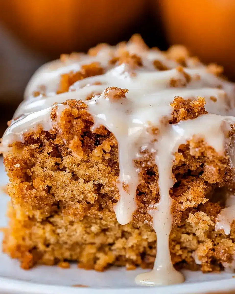 Moist pumpkin coffee cake slice with cinnamon streusel and glaze
