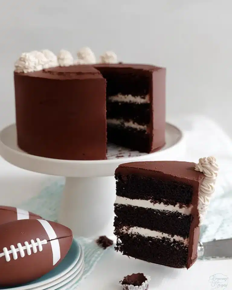 Rich Hostess Cupcake Layer Cake with marshmallow filling and chocolate ganache frosting.