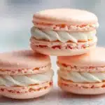 Peach French macarons with creamy vanilla buttercream