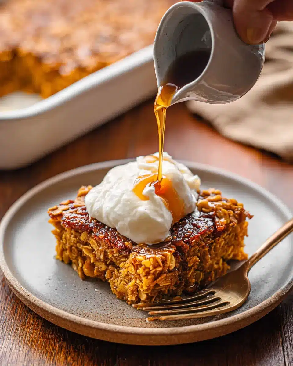 Pumpkin baked oatmeal topped with yogurt and maple syrup drizzle