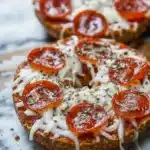 High protein pizza bagel with turkey pepperoni and melted mozzarella