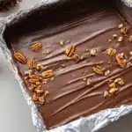 Homemade Christmas toffee topped with pecans and chocolate