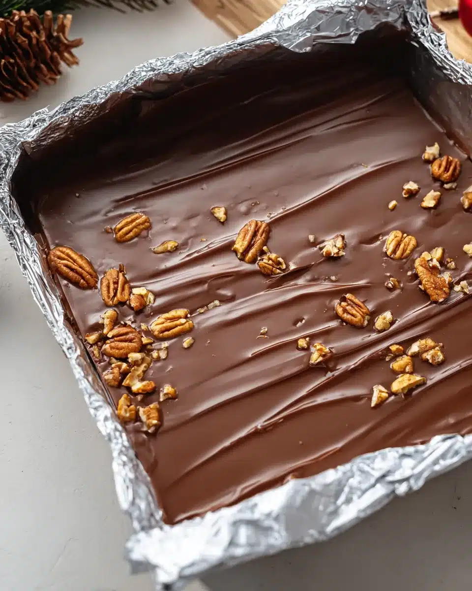Homemade Christmas toffee topped with pecans and chocolate